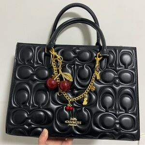 Coach Black Satchel with Cherry Charm and Gold Chain